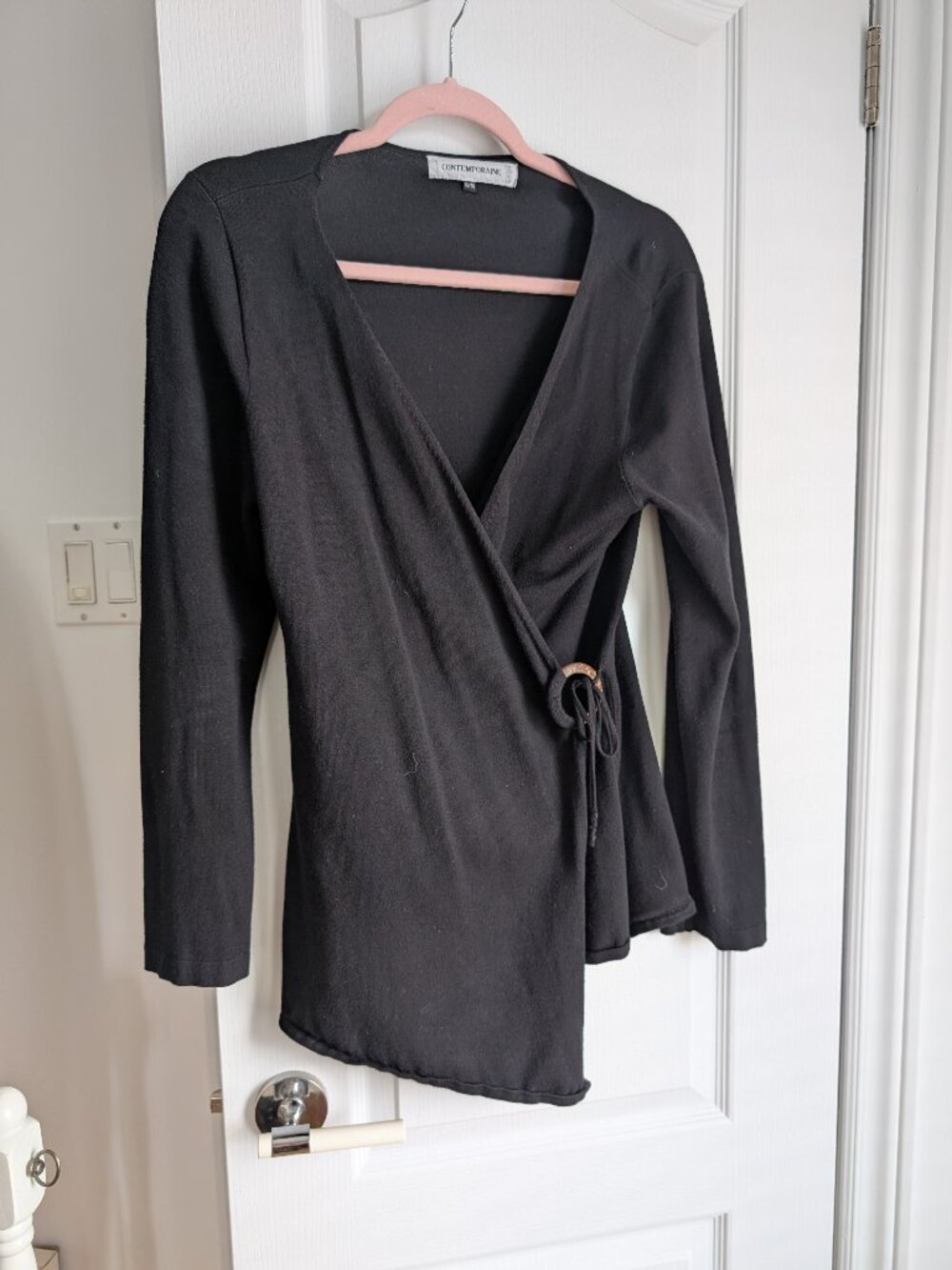 Assymetric top with a nice ornament in front. Size XL. Black